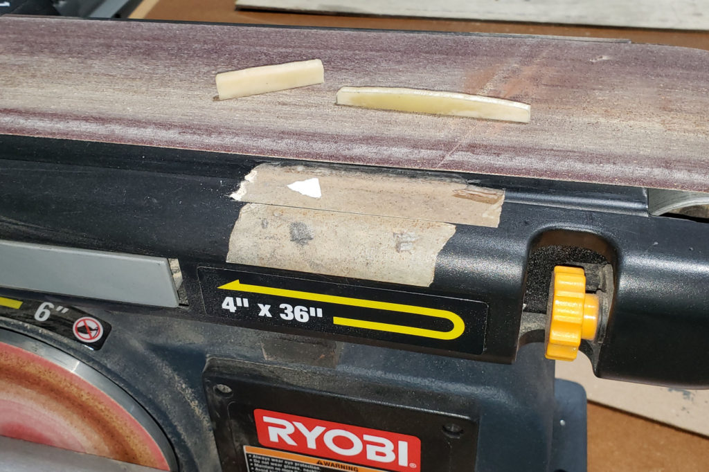 Using a belt sander to clean up shape