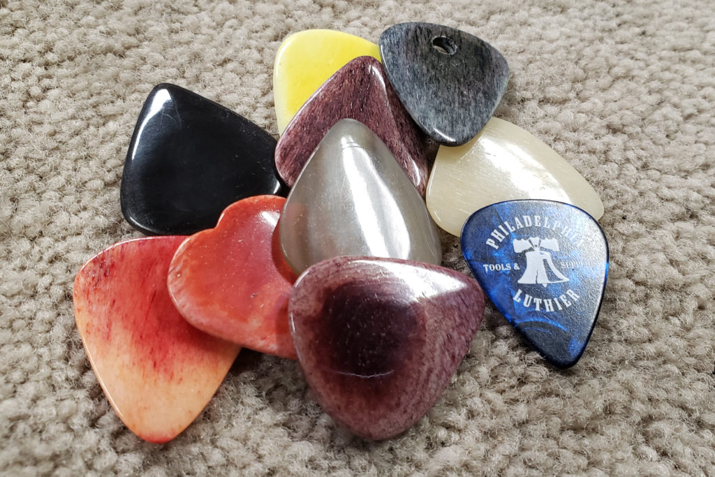 Samples of completed bone and buffalo guitar pick blanks